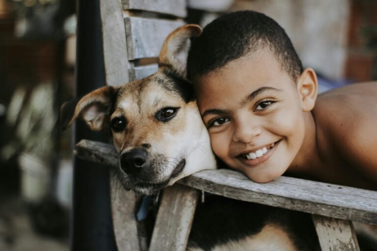 Boy posing next to his dog