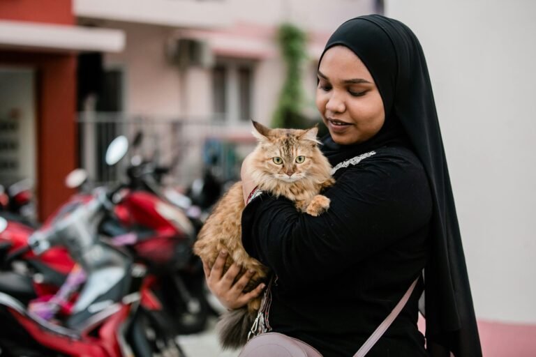 Woman with her cat after emergency visit at Seacoast Emergency and Referral Veterinary Hospital